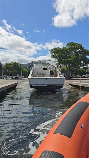 Pulling the 37' Trojan out on the quad axle trailer. She had a 14' beam and still had a good amount of water in the hull. | Fast Response Marine Towing & Salvage