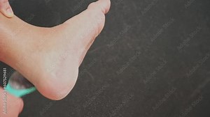 A metallic foot file for pedicure. One side is rough. It is designed to remove dead skin and calluses from the feet, leaving them smooth and soft. A great addition to anyone's self-care routine.