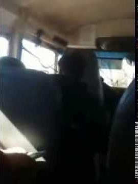 Girl kisses boy on bus