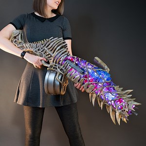 15M views · 191K reactions | Square Enix asked me to create the Grim Marrow blaster from the upcoming Outriders Game. It turned out to be one of my most favorite projects ever! I used super simple materials like eva foam, hot glue, acrylic crystals and pvc pipes. It took me 4 weeks to bring this monster together and it includes almost 400 LEDs, a working trigger and even a sound system! 領 Did you play the Outriders demo? Did you like it? | Kamui Cosplay | Facebook