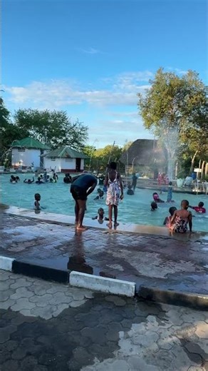 Kids Having Fun at Dar es Salaam Swimming Pool"