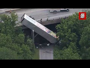 Semi-truck dangles off Pennsylvania overpass in shocking crash