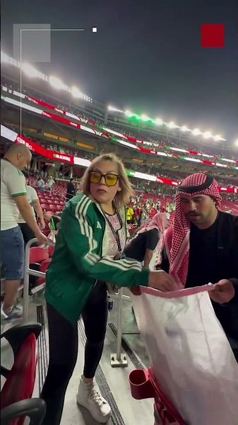 Jordanian and Algerian fans clean the stands of San Francisco stadium after the match