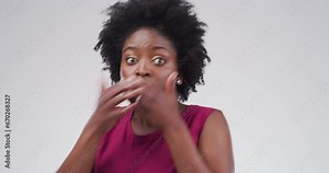 Face, shock and black woman with hands on mouth in studio isolated on a white background. Portrait, wow and surprise of African person with fear, scared at horror and bad news, announcement or gossip