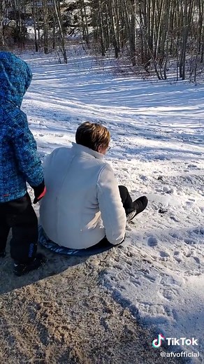 🎶Grandma got flipped over by a frozen sled 🎶 #sledding #sleddingfail #sleddinglife #snowfun #snowgames #snowfail #failarmy #grandmafail #fyp #frozen