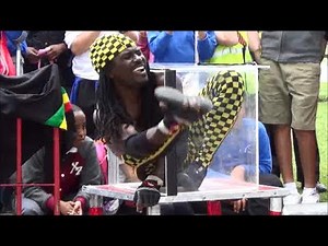 London Amazing Contortionist Folds Himself into a Box. Street performer