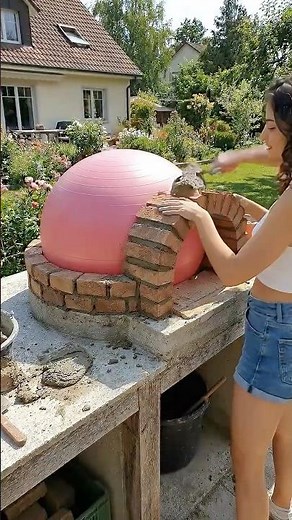 I built a real Italian pizza oven using a Pilates ball, cement and brick. DIY