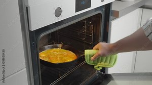 The video showcases cooking eggs in a skillet in the oven, perfect for culinary recipes and cooking blogs