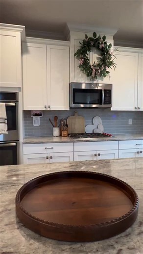 Liz Grella | Holiday Home Decor | DIY | Atlanta, GA on Instagram: "Spring centerpiece Comment SHOP for links inspiration with neutral Easter decor, layered textures, and soft pastel accents. I styled the tray with woven bunnies, pink tulips, and warm accent lighting created an elevated spring table centerpiece that works for kitchens, dining tables, and seasonal home decor. This pretty egg lights up and has a timer as well. #springcenterpiece #springhomedecor #easterdecor #seasonaldecor #homedec