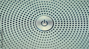 A man pushes power button to turn computer monitor on and off. off button on a laptop keyboard