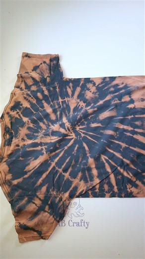 AB Crafty on Instagram: "Bleach Tie Dye Basics - I went through a big tie dyeing phase and learned you can actually use bleach as a dye. It's called reverse tie dye as the bleach removes color from the fabric. It's a great way to tie dye dark clothes. My husband was nice enough to donate his lamb of god shirt to the cause so I could demonstrate the technique with a classic spiral design. #tiedye #bleachtiedye #reversetiedye #tiedyefashion #lambofgod"