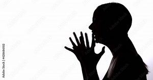 Female silhouette. Mental disorder. Nervous breakdown. Dark contrast profile outline portrait of frustrated annoyed woman yelling crying isolated on white empty space background.