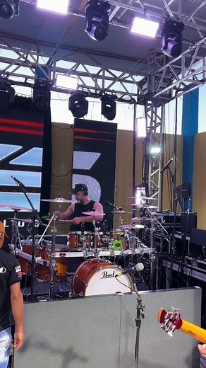 Live Stage Performance by Drummer and Guitarist