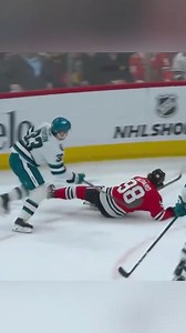 Addison awkwardly pins Bedard onto the ice. Johnson retaliates by spearing Addison in his mid section. | Jody Ritchie