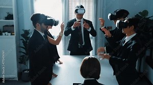 Professional project manager working on laptop and sending data analysis to business people by using VR glass with hologram of financial data analysis or holographic software development. Directorate.