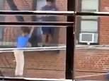 Horrifying moment woman plunges three floors from fire escape