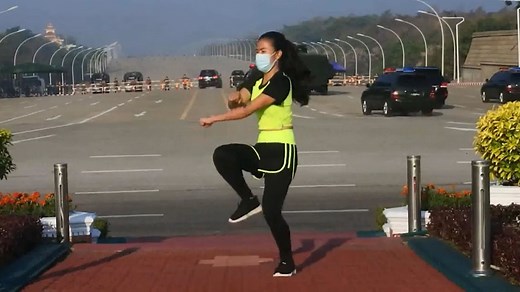 Woman films exercise video as Myanmar's coup unfolds behind her