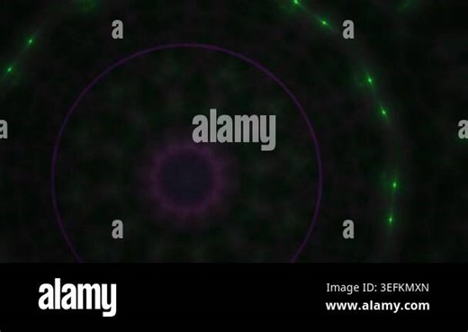 A mesmerizing abstract visualization of a green energy orb, pulsating with light particles against a dark background, suggesting cosmic or technological phenomena Stock Video Footage - Alamy