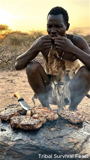 Hadzabe Hunter Cooking Meat on Hot Stone – Primitive African Cooking in the Wild! #shorts