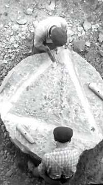 Watch Stonecutters Turn Raw Basalt Into a Perfect Millstone!