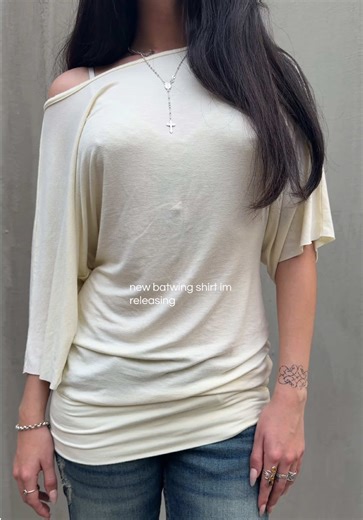 early 2000s women’s batwing shirt | iheaped on ig | bella in one of our two color ways | #outfitinspo #2000sfashion #fitinspo