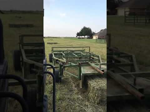 Gathering 2 wire small square bales with Rafter M 10 bale accumulator.