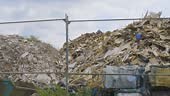 board, rubble and builders bags at waste disposal and recycling site