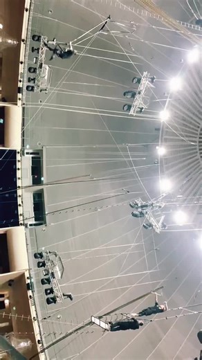 Acrobatic Tightrope Stunts in Indoor Arena
