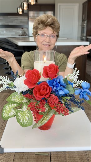 Flip It. Decorate It. Light It. ❤️🕯️ An upside-down glass and a whole lot of creativity. This 4th of July DIY turns pretty red white and blue flowers into a candle holder patriotic centerpiece #4thofJuly #decor #happyfourthofjuly | Getti