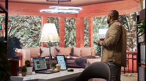 Corporate businessman looking into project details and timetables on laptop at his home, establishing budget and operations to achieve startup goals in a competitive environment. Camera B.