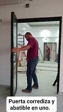 puerta corrediza y abatible en uno. material aluminio y cristales de 6 milímetros