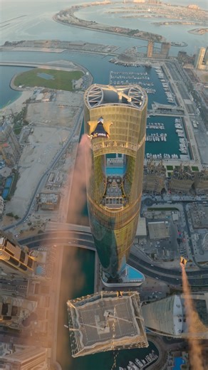 Skydivers fly through world’s tallest hotel