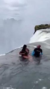 South African Beauty taking the risk to swim on the edge of Devil's pool Victoria falls Zambia 🇿🇲😱😵‍💫 #video #videoreelsシ | One Africa