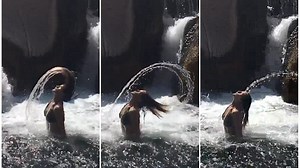 Amanda Byram, 48, shows off her baby bump in frilly white gown