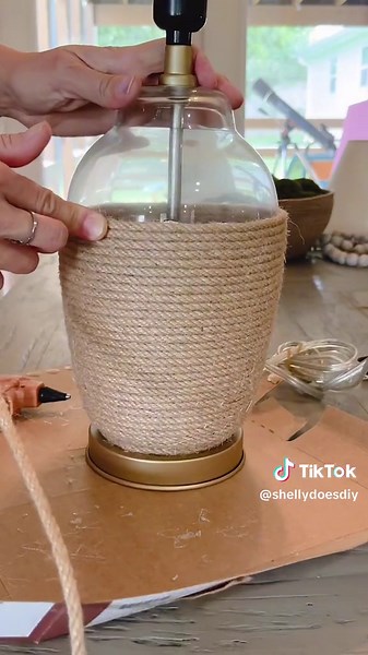 DIY rope lamp DETAILS👇🏽 I recently saw a gorgeous rope lamp online for $300 so, when I found a pair of lamps for $15 on Facebook Marketplace, I decided to try to make one myself. This couldn’t have been easier. Grab an old lamp, some jute rope and your hot glue gun, and wow your guests with your gorgeous lamps. #juteropecraft #easydiydecor #diydecorideas #jutecraft