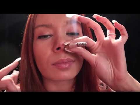 girl smoking through nose and coughs