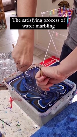 Art Daily Dose on Instagram: "Water marbling art is a deeply satisfying technique where artists create mesmerizing patterns on the surface of water. They drip and manipulate vibrant colors to form intricate designs, which are then carefully transferred onto various objects. This process, characterized by fluid motions and captivating results, provides a meditative experience and highlights the unique beauty of this art form. Artist: @raynbowcrowstudios #art #satisfying #watermarbling"