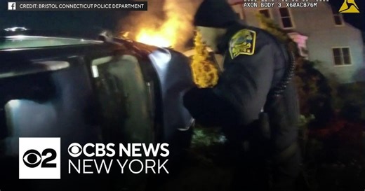 Video shows Connecticut police rescue woman from burning car