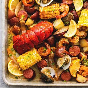 Sheet Pan Clambake- Sheet pan clambake with flavorful shrimp, sausage, lobster tails, clams, and veggies all made on one pan. The easiest, tastiest way to enjoy a clambake! RECIPE: https://www.lecremedelacrumb.com/sheet-pan-clambake/ | Creme de la Crumb