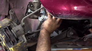 Car Drive Axle Repair and Replacement in the Repair Shop Stock Video