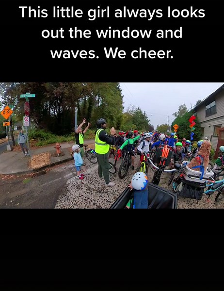 We have to wait at this crossing for everyone to make it down the big hill safely & to cross the busy road as a big group all together. #BikeBus