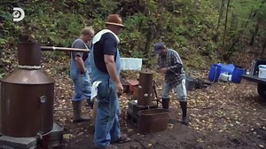 Mark and Digger reunite with an old friend to help perfect his misty-looking honey moonshine recipe. #Moonshiners | Discovery Channel Australia