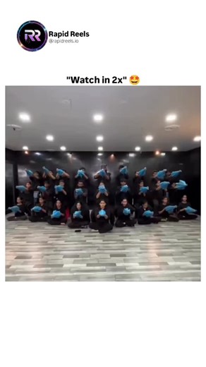 Rapid Reels on Instagram: "This mesmerizing spectacle is more than a dance performance—it is a precisely engineered display of synchronized visual art. Through disciplined movement, geometric alignment, and flawless coordination, performers transform identical blue props into layered patterns that resemble computer-generated imagery. Each dancer functions like a pixel in a living, moving canvas, a technique commonly seen in large-scale Asian stage productions and cultural showcases. The use of b