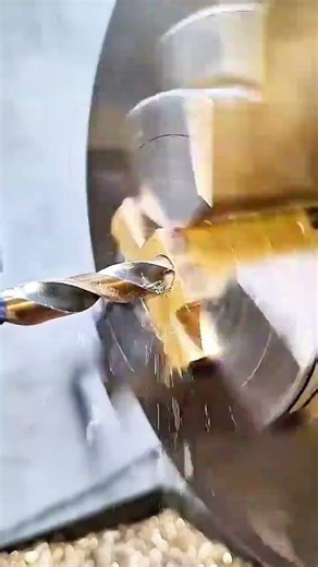 Brass block meets spinning bit—vise holds firm as cutter drills precise path