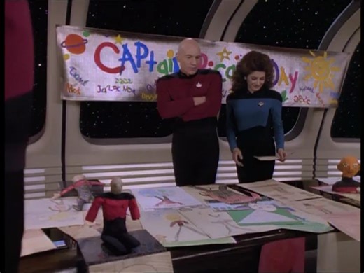 Starfleet Records: Jean Luc Picard, Captain of the USS Enterprise NCC-1701-D. Treaty of Algeron. SD: 47457.1 (2370) In the observation lounge aboard the USS Enterprise-D, a brightly-colored banner hanging by the room's viewports proclaims it to be "Captain Picard Day". Picard, somewhat unhappy with the idea, surveys the numerous entries made for the event by the crew's children with Deanna Troi, as Commander Riker looks on, amused. Riker playfully uses one of the dolls and imitates Picard's voic