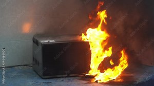 microwave oven on fire. the concept of fire in the kitchen and malfunctions, breakdowns of electrical appliances and wiring, installation of fire safety systems.