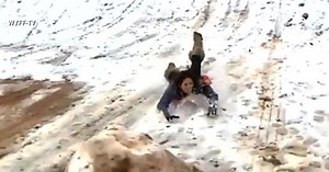 Reporter crashes into massive snowball