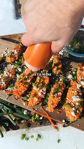Buffalo Chicken Jalapeño Poppers Recipe: -Slice jalapeños in half and scoop out the inside. -Make filling by combining: 1 cup shredded chicken 1 cup shredded cheese 4 oz whipped cream cheese 1/4 cup hot sauce 2 tbsp ranch dressing 2 tsp chicken rub -Fill the jalapeños with the filling. -Grill indirect at 375F for 25 minutes. -Drizzle with buffalo sauce, top with blue cheese crumbles, green onion and enjoy! | Kingsford
