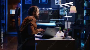 Engineer working on computer and laptop, using AR tech to do coding, drinking coffee. Developer at home using augmented reality technology on PC and notebook to do programming