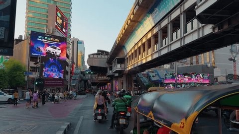 clip-3992555067-bustling-bangkok-street-under-bts-skytrain-station